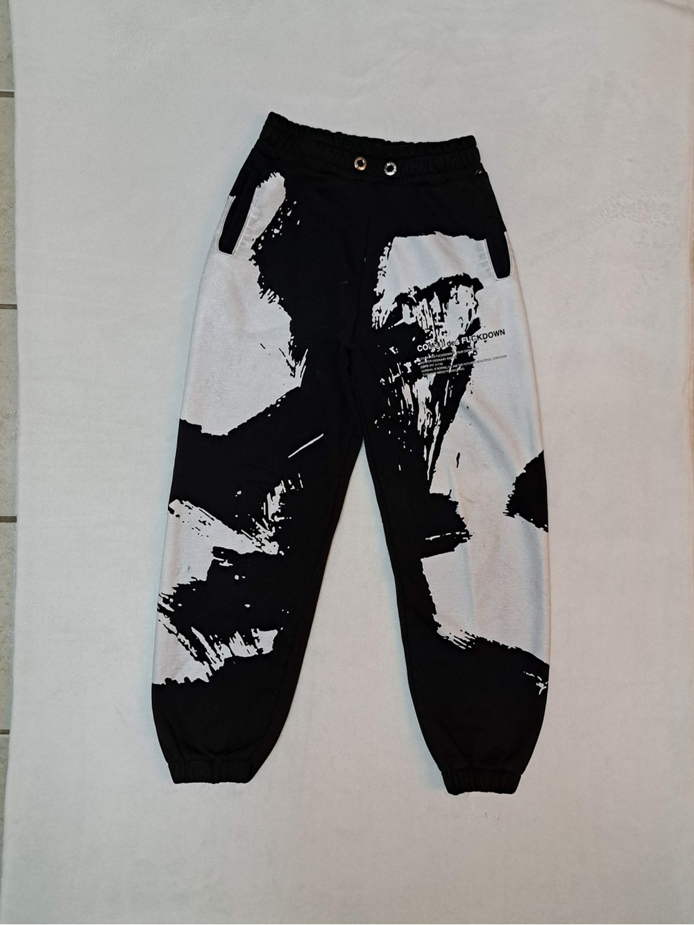 Comme des Fcukdown black and white brushstroke print sweatpants